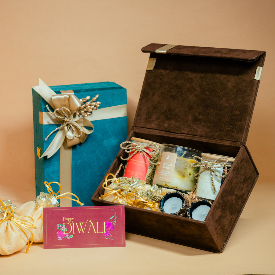 Black premium Diwali gift box with gold glassware, candles and client logo for corporate gifting, by Demould