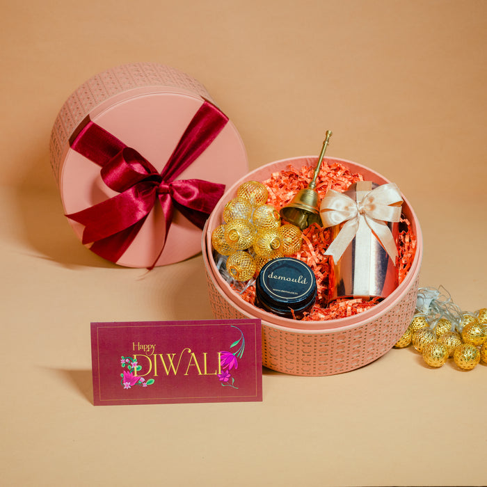 Plush velvet Diwali hamper box with scented candles and a Diwali greeting card, by Demould Delhi
