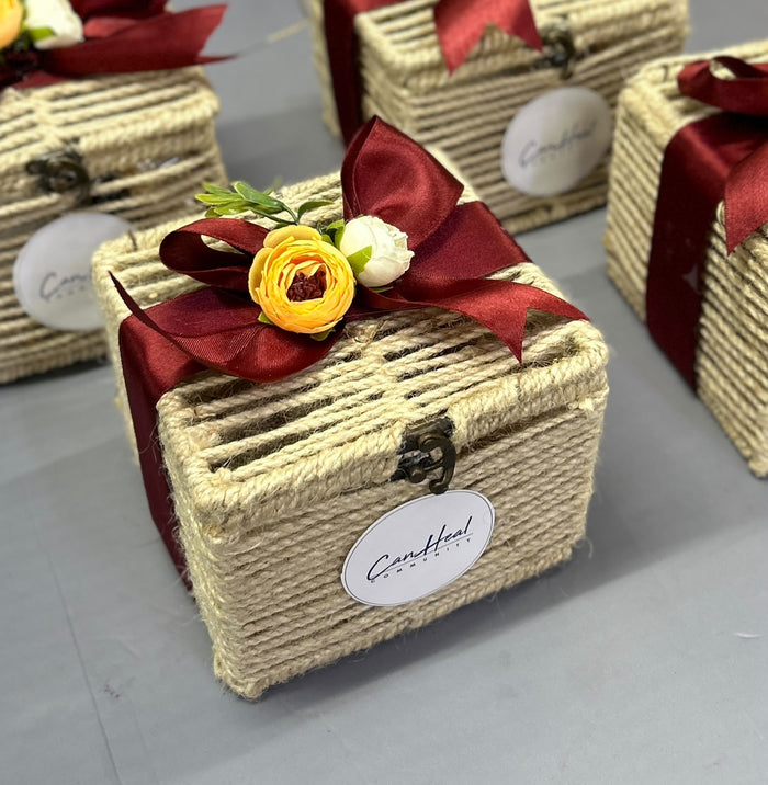Eco-friendly jute rope Diwali hamper box with satin bow, fresh flowers and branded tag, by Demould Delhi