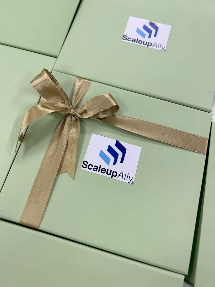Sage-green corporate Diwali gift boxes with company logo and satin ribbon for bulk employee gifting, by Demould