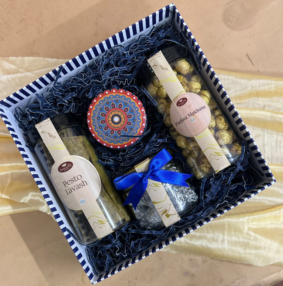 Healthy Diwali gift box with pesto lavash, flavoured makhana and a hand-painted diya, by Demould Delhi